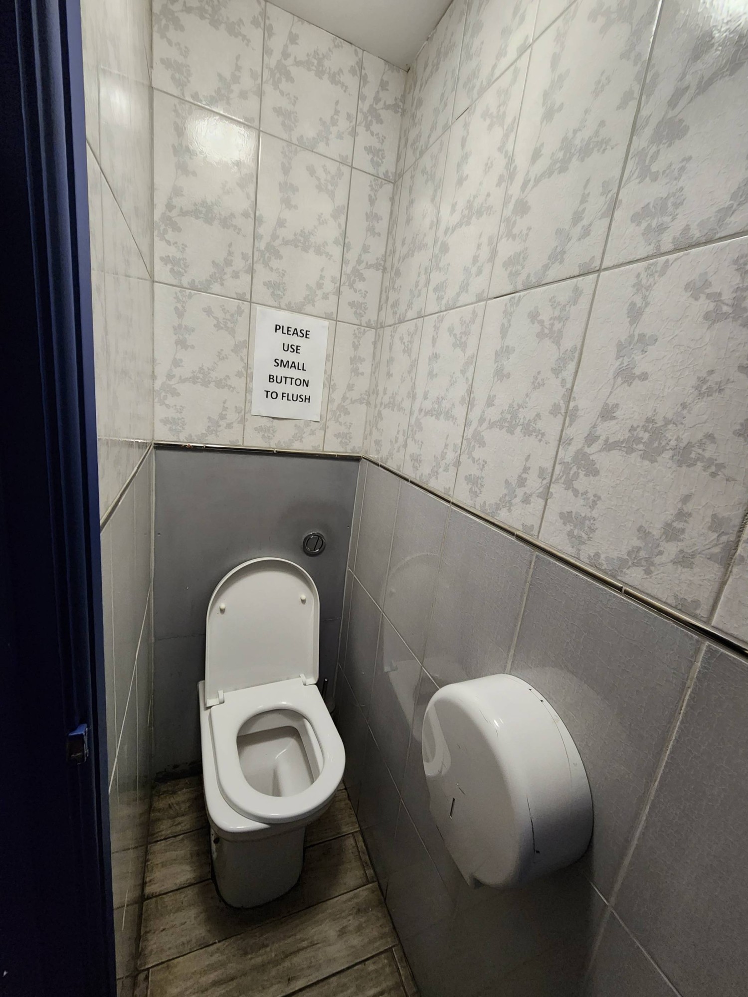 From cubicle door, looking left. Toilet straight ahead.