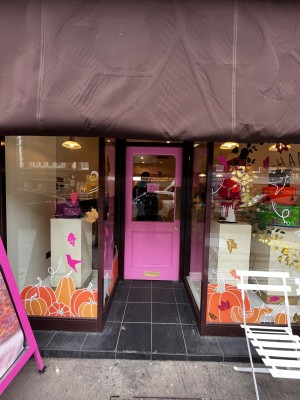 One step up to pink glass door. Push from right to open.