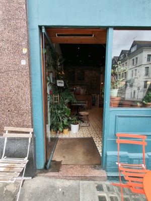 Glass door. Push golden handle on right to open.