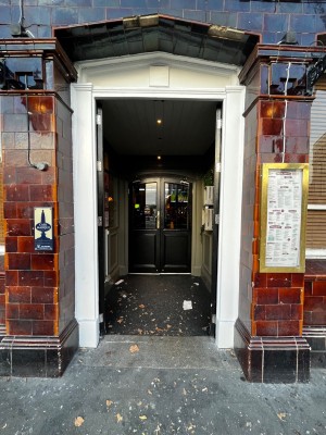 Black doors ahead. Push from middle to open.