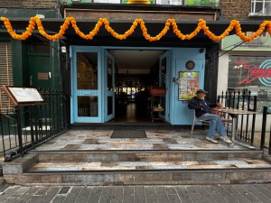 Two steps up to entrance area. Door directly ahead.