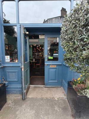 Blue framed glass doors. Pull golden handled in centre to open.