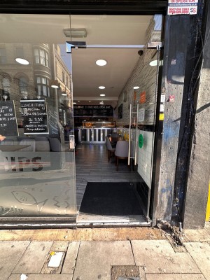 Glass door ahead. Push door to open via handle on left.