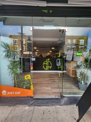 Single glass door. Handle on left. Push to open.