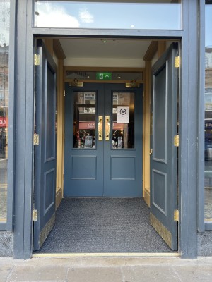Two sets of double doors first opens inwards from the centre, second opens outwards from the centre.