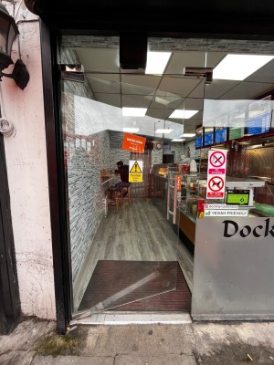 Glass door. Push from right to open.