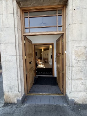 Wooden doors ahead. Push from center to open.