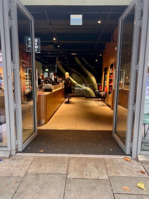 Wide, double doors and no stoop/gradient at the entrance.