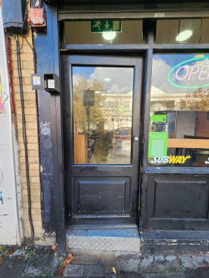 Black door. Push from right to open.