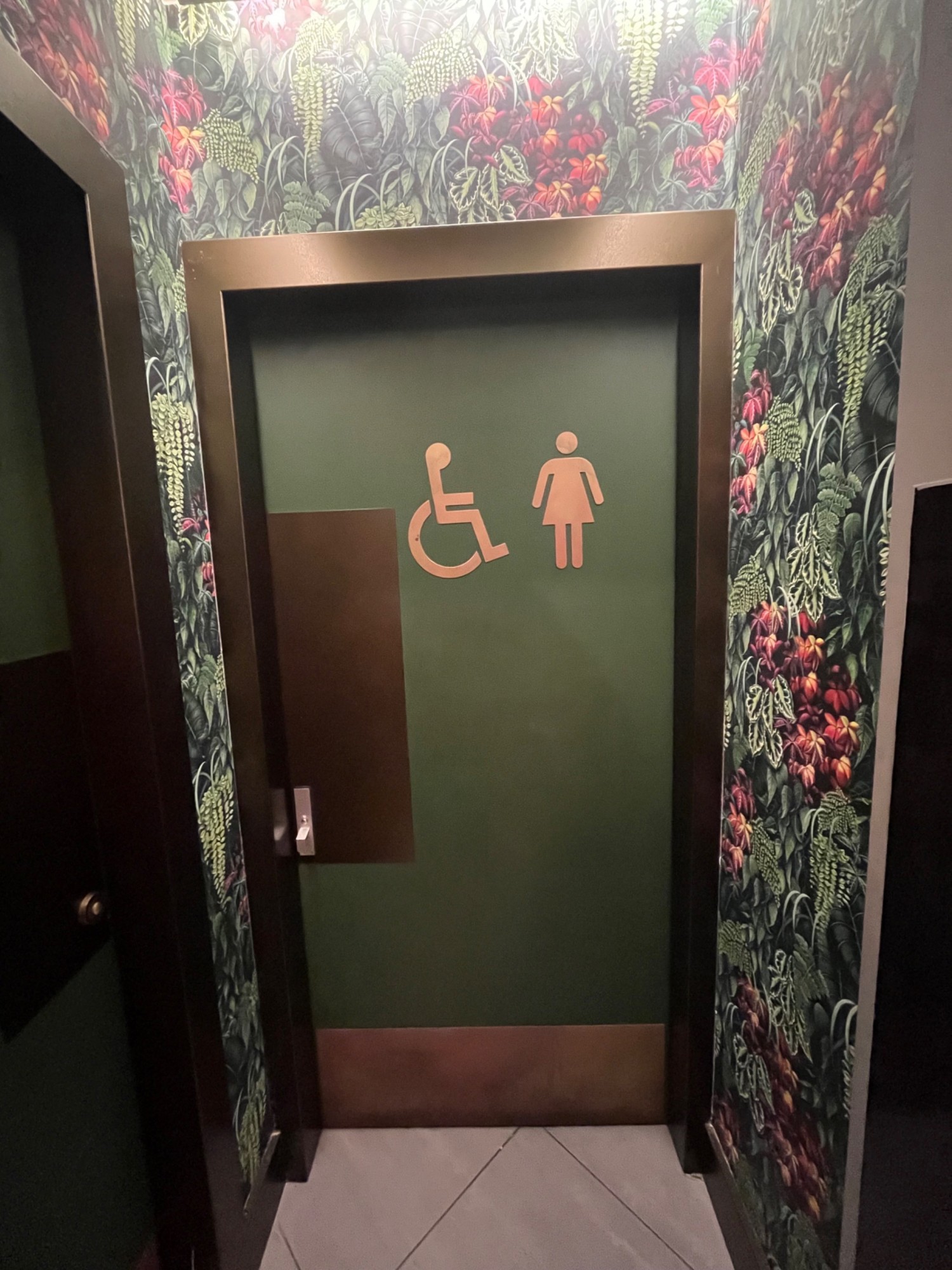 From first door, second door to bathroom, push to open.