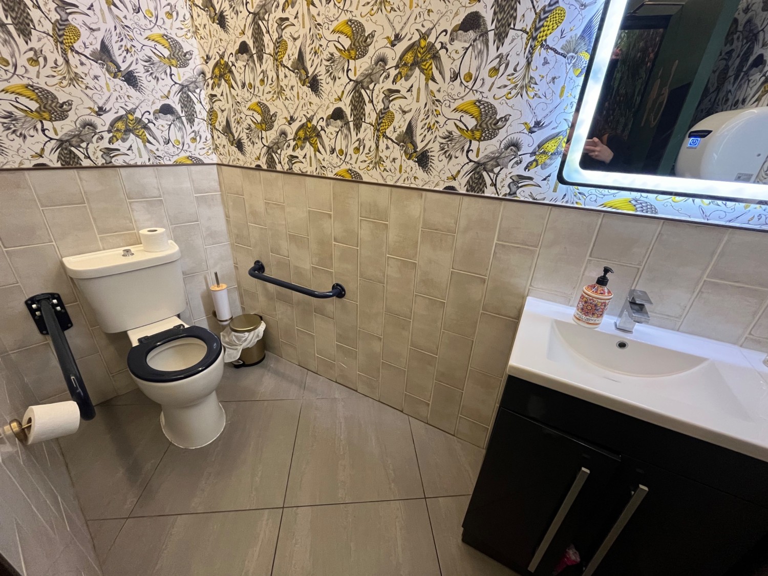 From second door looking slightly right. Sink to right. Toilet to left along back wall.