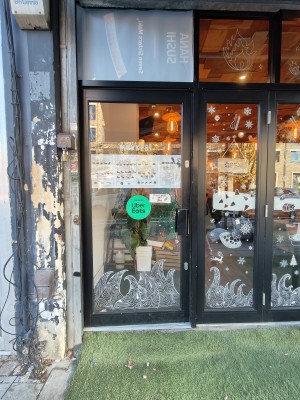 Black framed glass door. Push black metal handle on right to open.