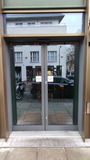 Automatic glass doors ahead. Slide open from centre when approaching.