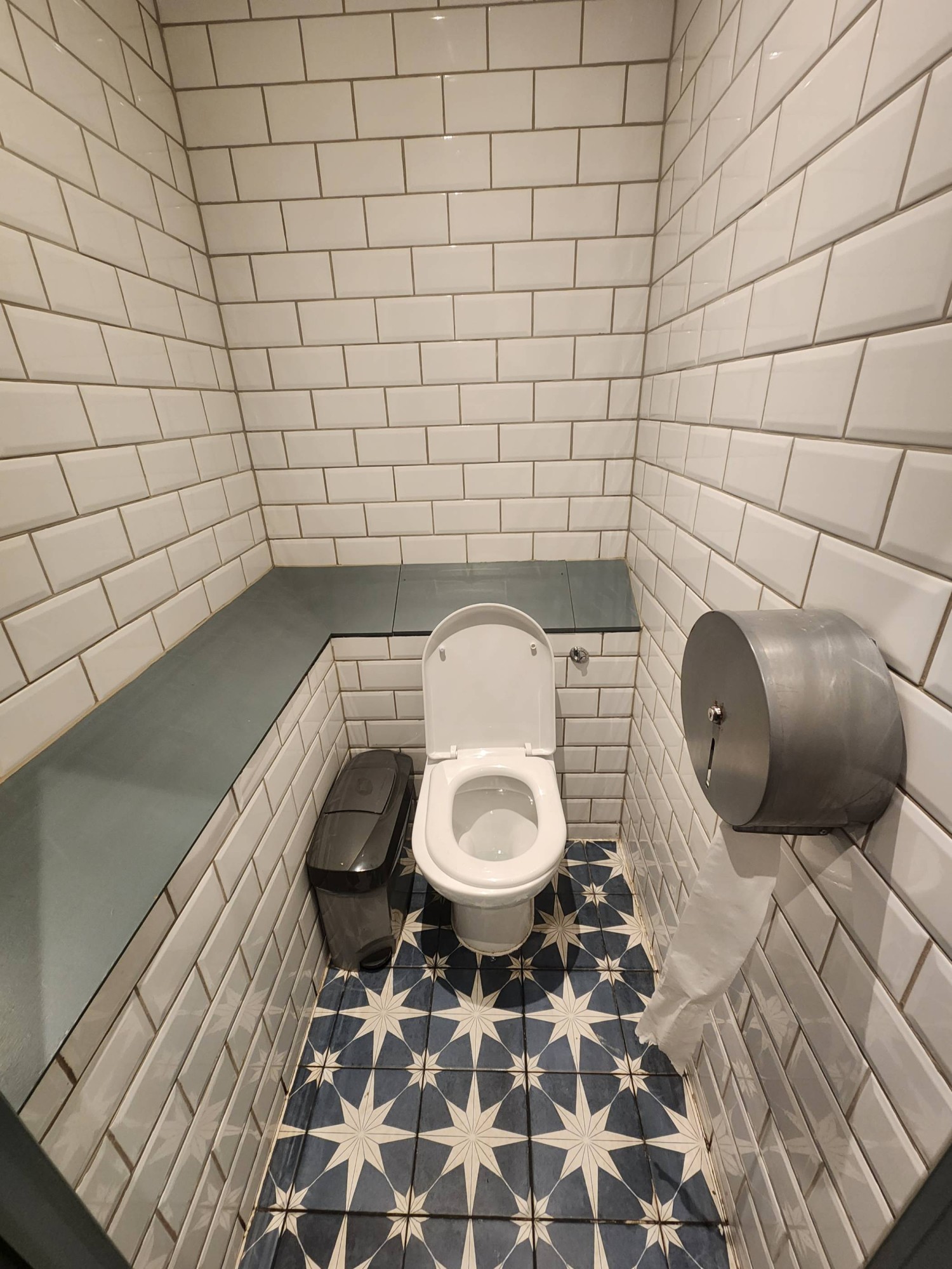 From cubicle door, looking straight. Toilet ahead.