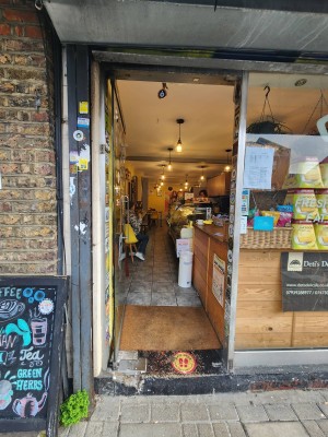 Glass door with handle on right. Push to open.