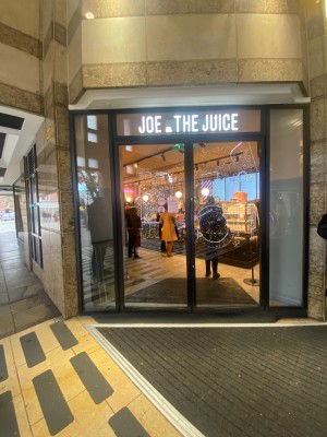 Glass double doors in front. Push from middle to open.
