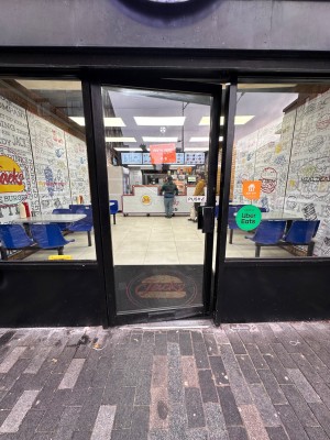Glass and metal door, push from right.
