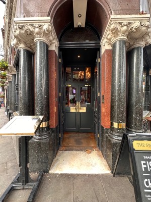Double wooden and glass doors. Push from center.