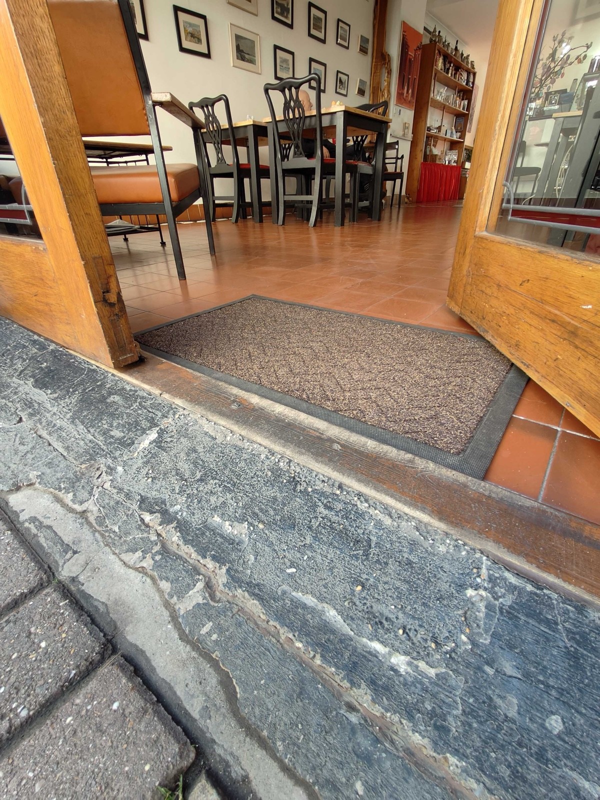 Small bump at foot of door. Doormat following