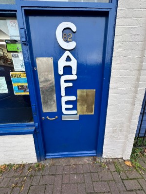 Blue entrance door. Push golden handle on left hand to open.