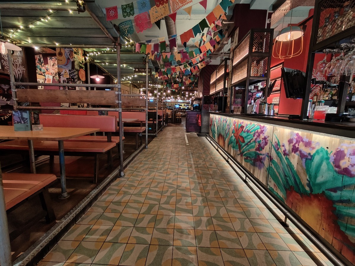 From beginning of bar facing left. Booths along left.