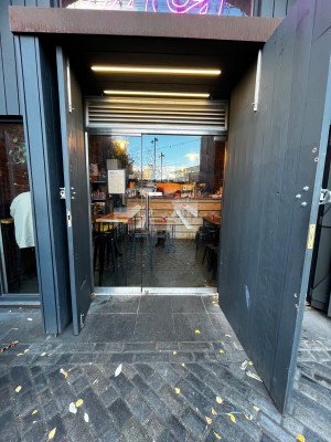 Glass door. Pull from left to open.