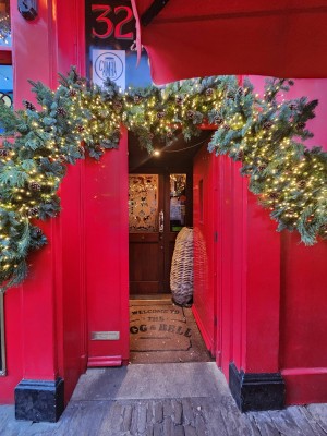 Red door. Handle on left. Push to open.