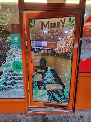 Orange framed glass door. Push orange handle on left to open.