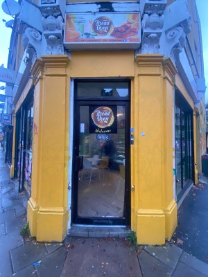 Single glass door leading to main area. Push from left to open.