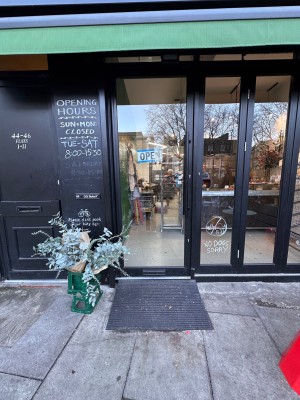 Metal and glass door. Push from right to open.
