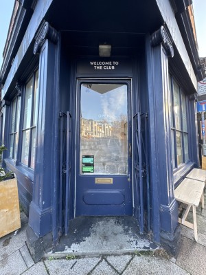 Small step to enter, with single glass door opening inwards from right to left