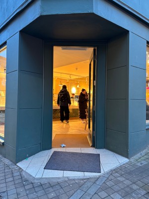 Steep inclined ramp to enter with manual door opening inwards from left to right.