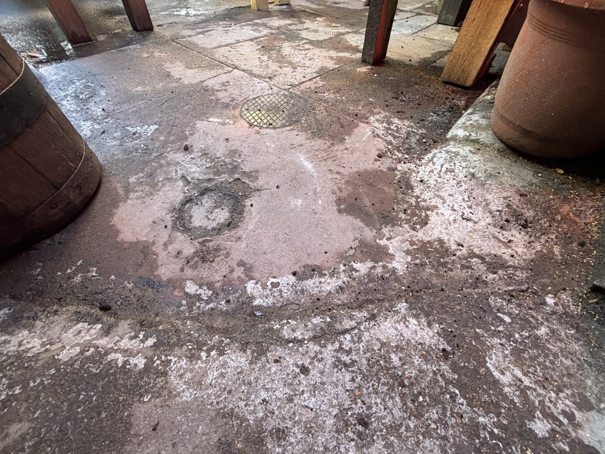 Small bump at foot of archway.