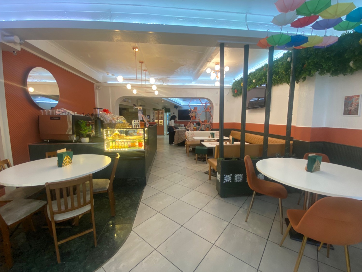 From entrance, looking right. Tables and chairs immediately ahead to left and right. Pathway along middle.