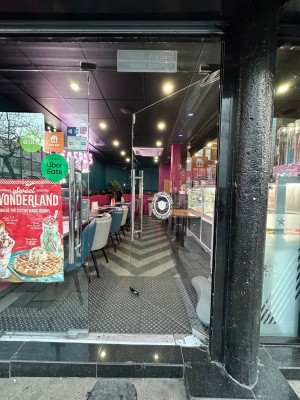 Glass door ahead. Push from left handle to open.