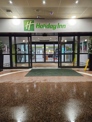 2 sets of doors; both sets of doors are glass automatic sliding doors.