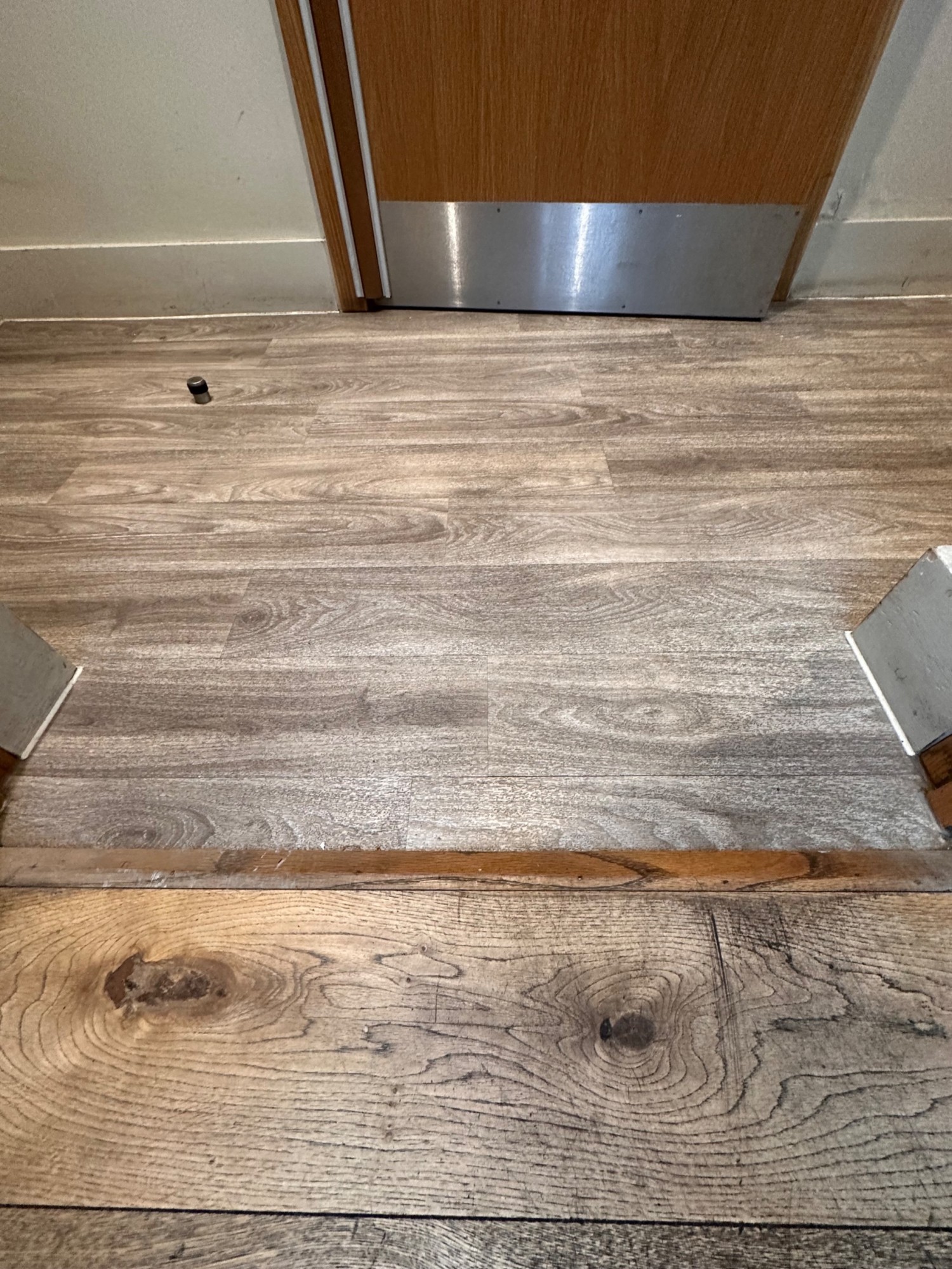 Small bump at foot of door.