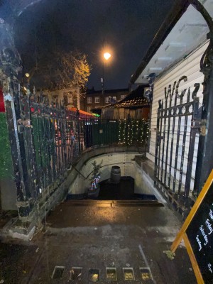 Gates straight ahead. If closed, push from middle to open.