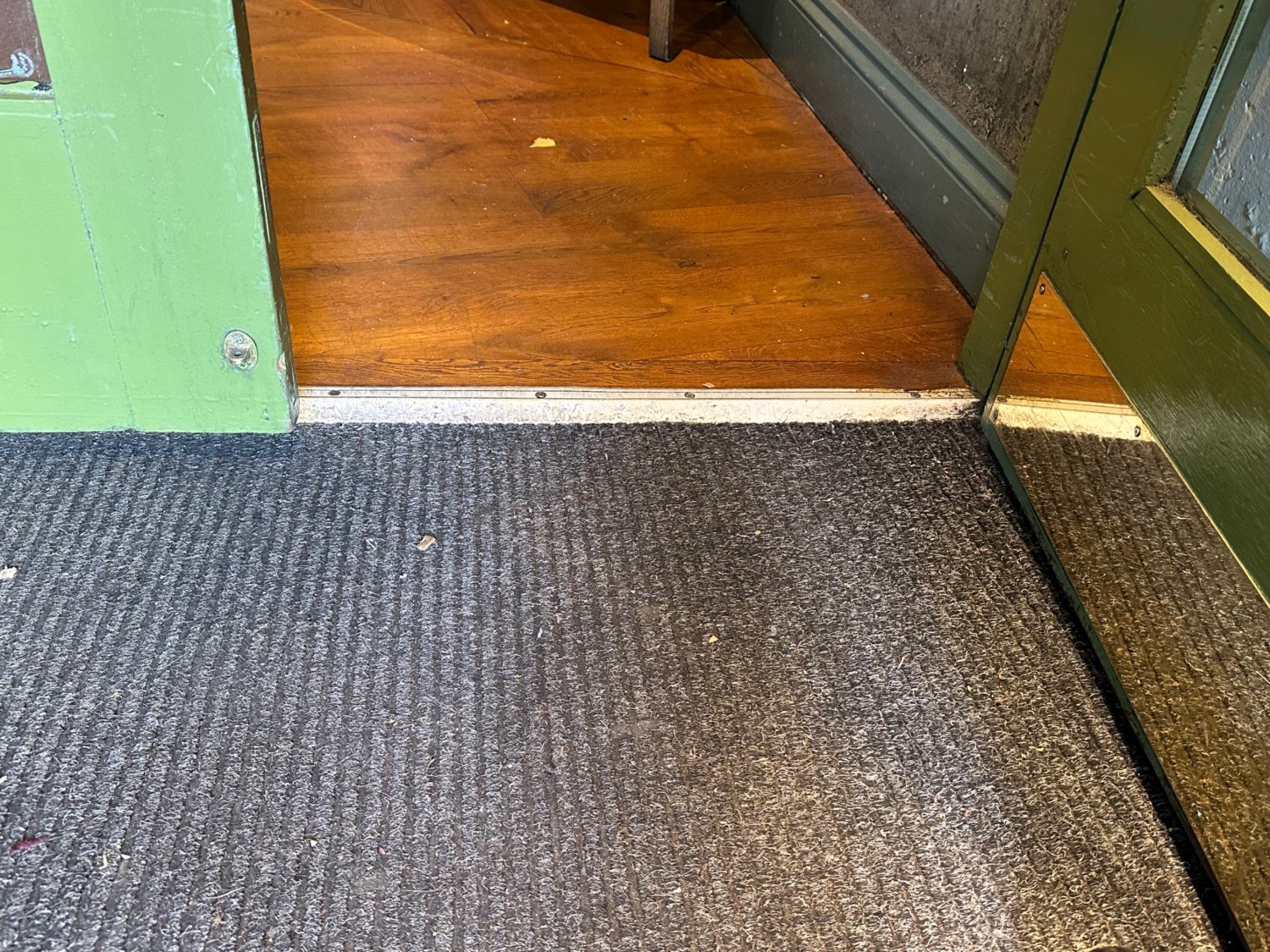 Small bump at foot of second set of doors.