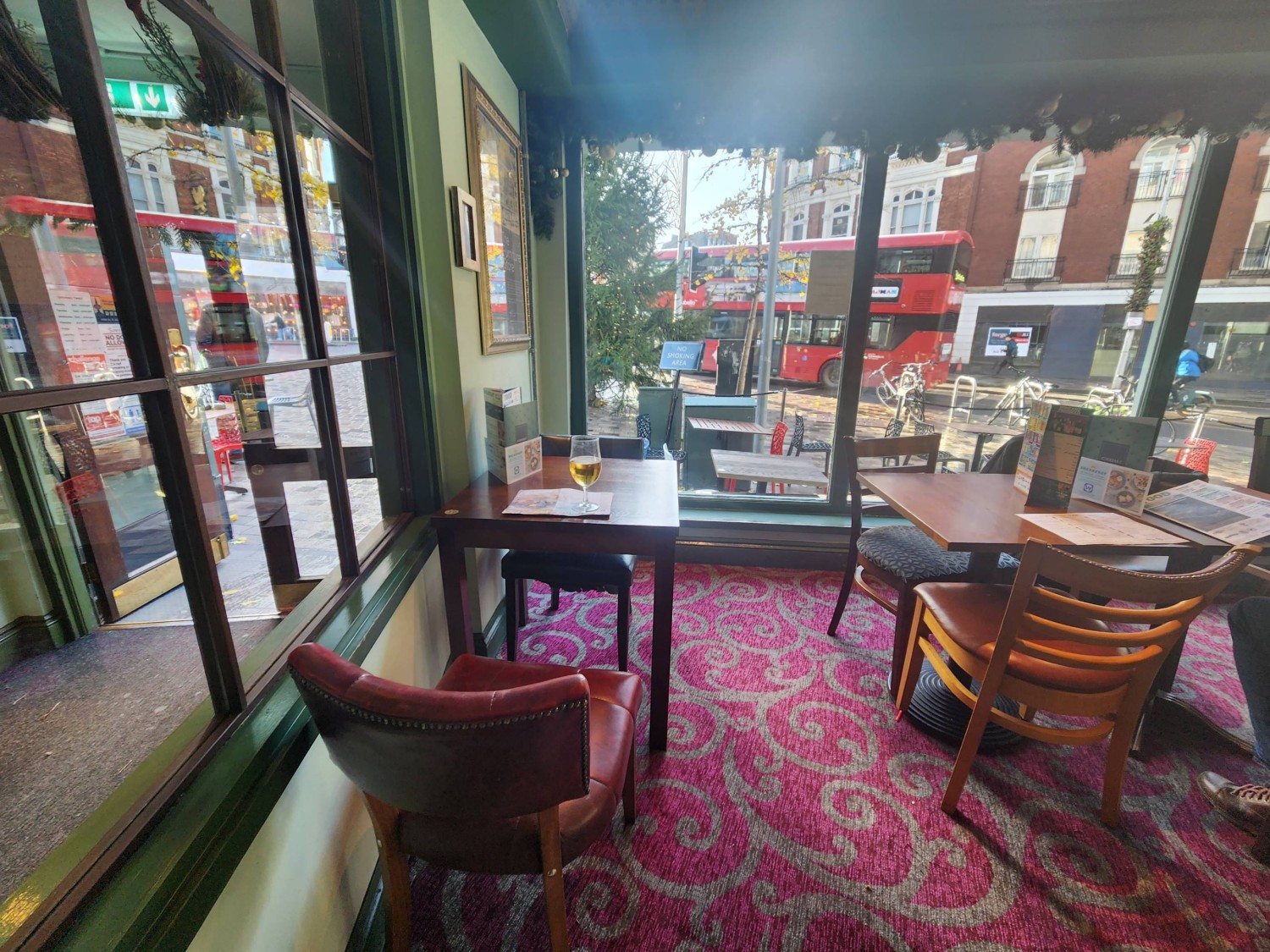 From step, looking slightly left. Tables and chairs directly ahead and ahead to right.