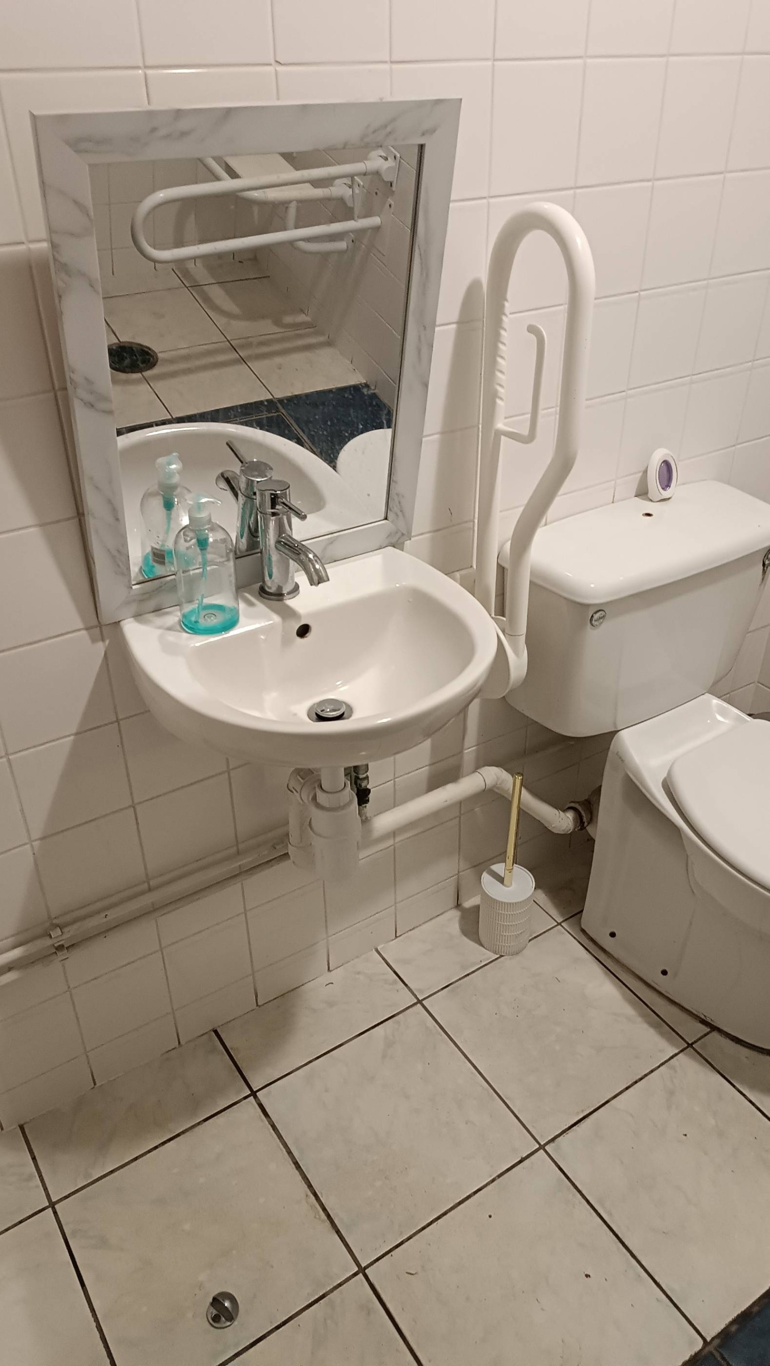 Low sink with small mirror
