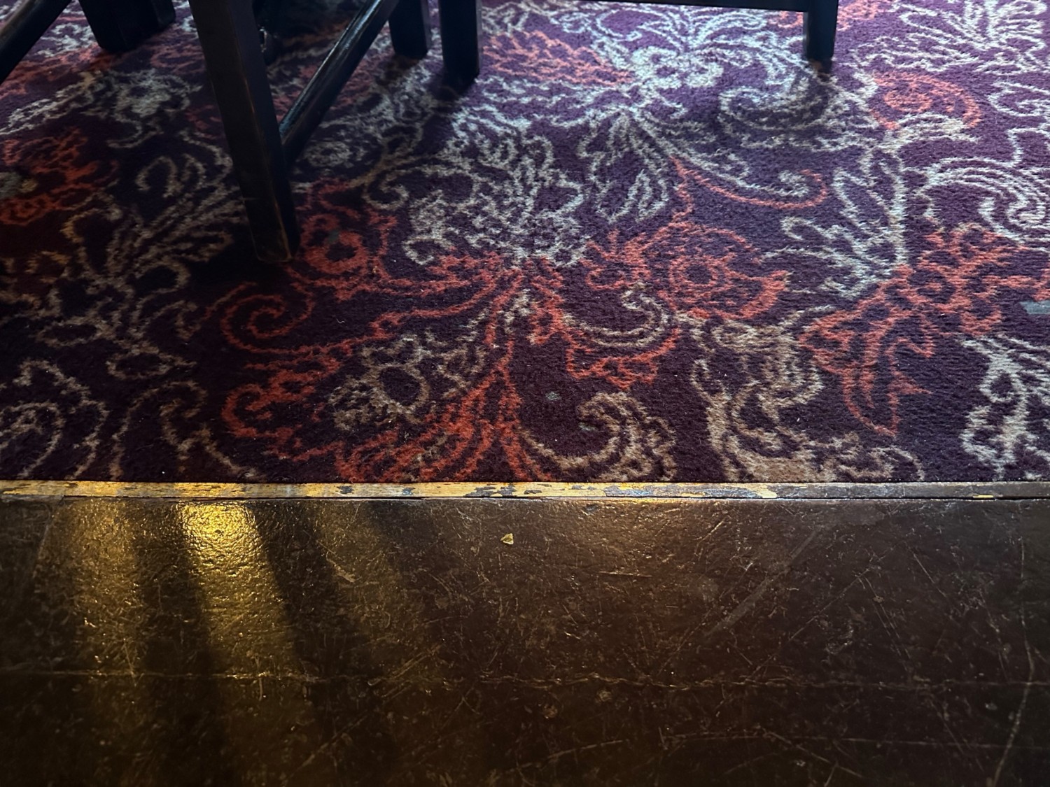 From high half booth facing left. Small bump before carpet.
