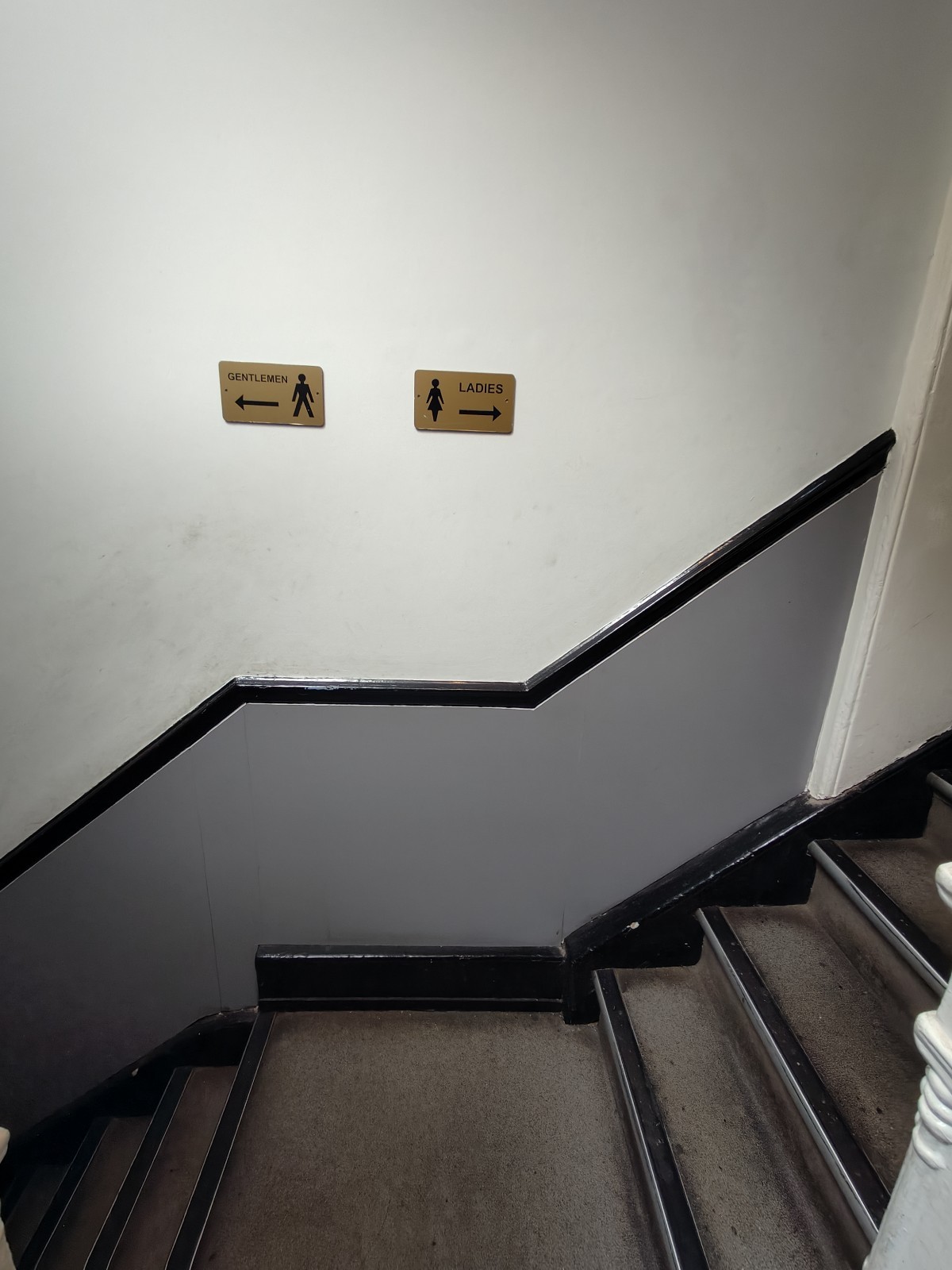 From first landing facing right. Stairs for female toilet on right. Male toilet on left.