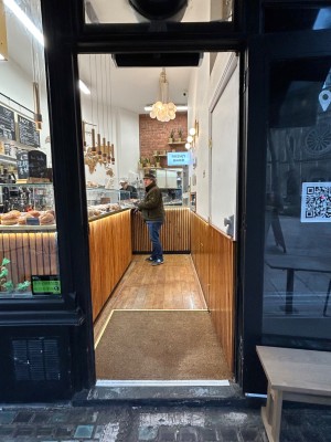 Glass door. Door slides open.