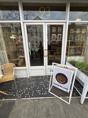 Facing front double glass doors. Pull handles in middle to open.