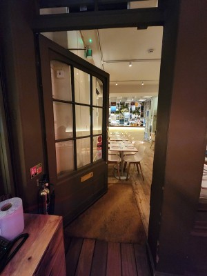 Green door. Push from right to open.