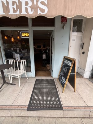 One step up to main entrance at the back. Doormat on top of step.