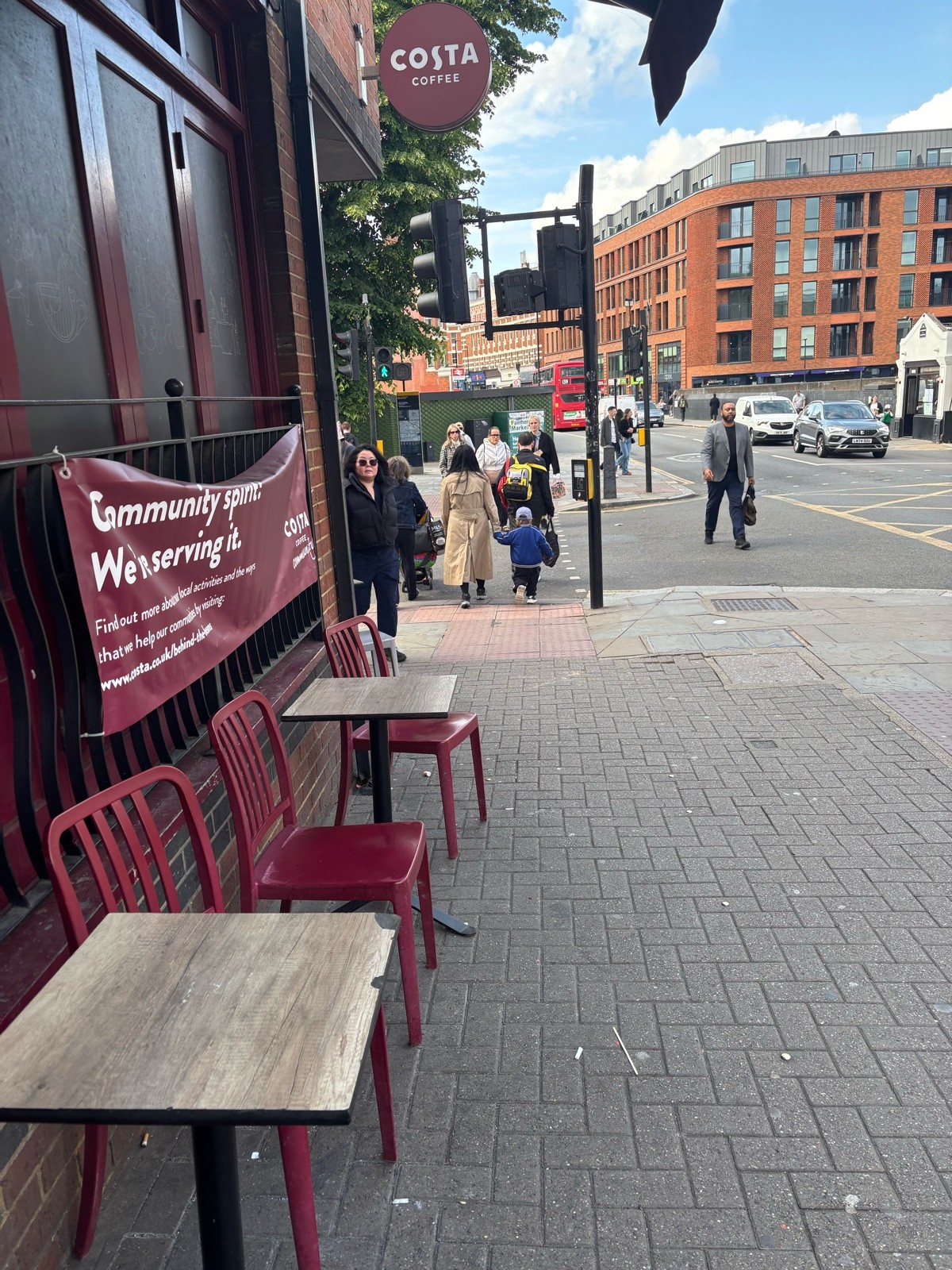 From alternative entrance facing straight. Tables and chairs along left.
