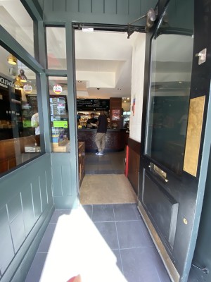 Glass with wooden frame ahead. Push from left to open
