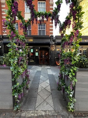 Open archway leading to doors directly ahead.